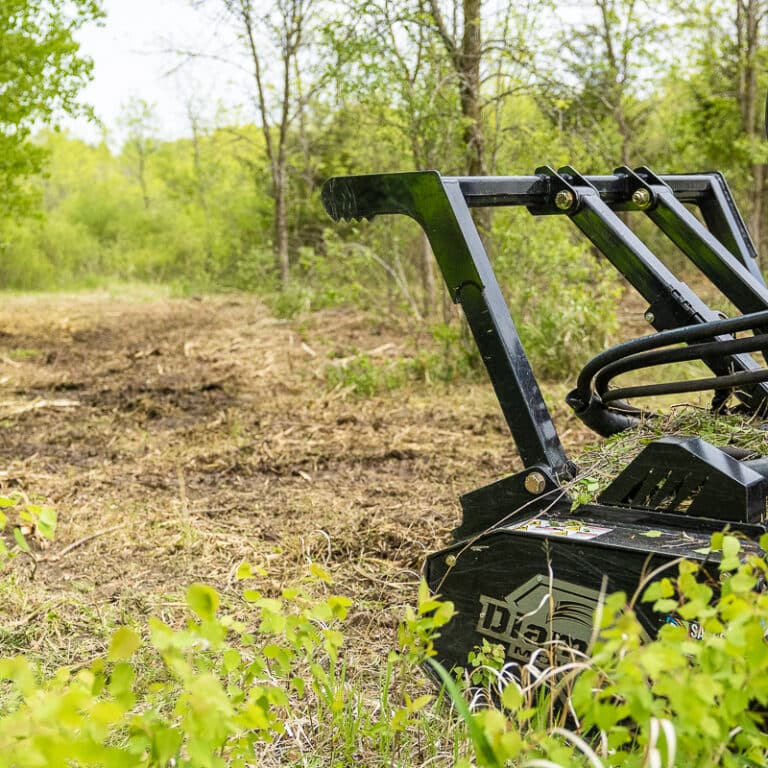 skid steer drum mulcher in field