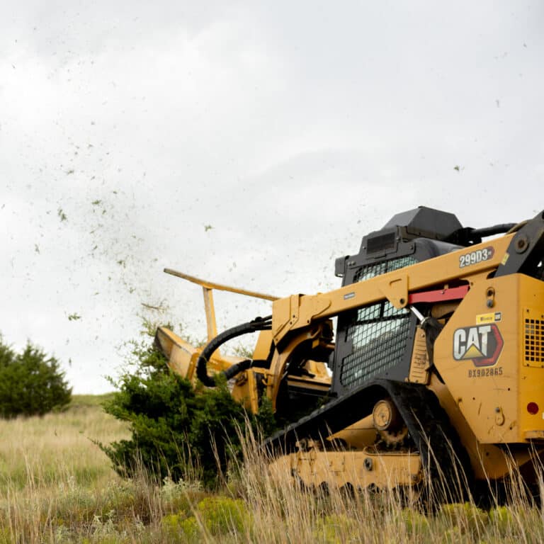 skid steer diamond drum mulcher in trees