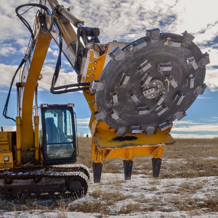 excavator with a disc mulcher