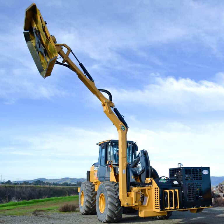 wheel loader with a brush cutter attached