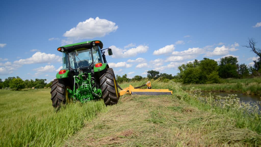 tractor with side rotary mower