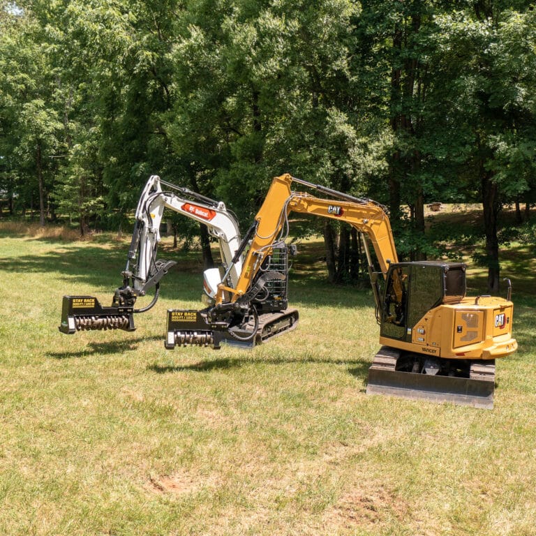 two excavators with drum mulchers attached