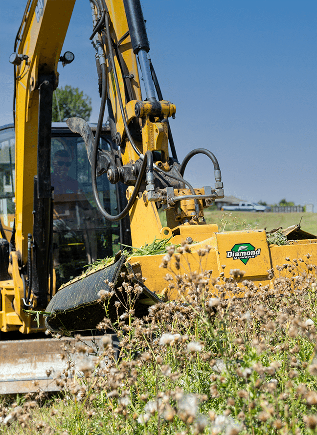 excavator with rotary mower