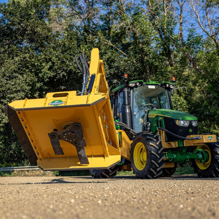 tractor with rear cradle boom rotary mower attached