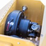 optional clutch for a mid mount boom tractor attachment