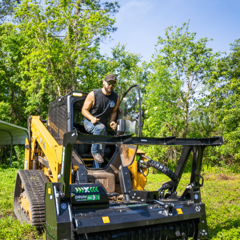 Man exiting skid steer with polycarbonate door open